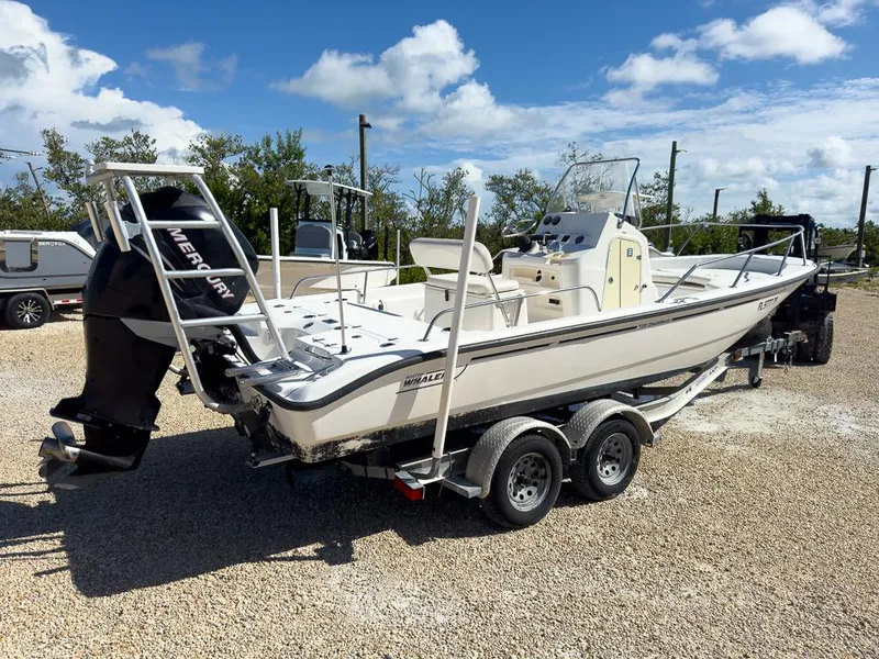 Slide: The Image of 2007 Boston Whaler 220 Dauntless boat on a trailer with Mercury outboard motor. - 3