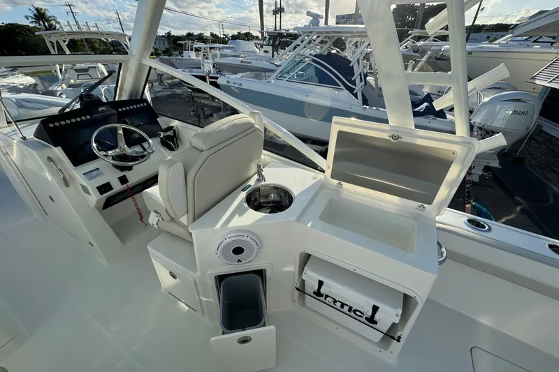 Slide: The Image of Interior view of 2026 World Cat 280 DC-X boat with helm and seating area. - 12