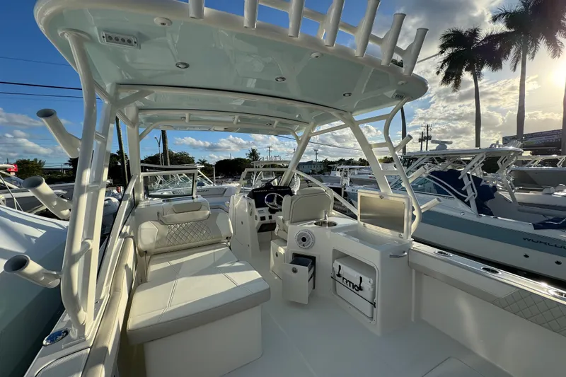 Slide: The Image of Interior view of 2026 World Cat 280 DC-X boat, featuring seating and helm station. - 20