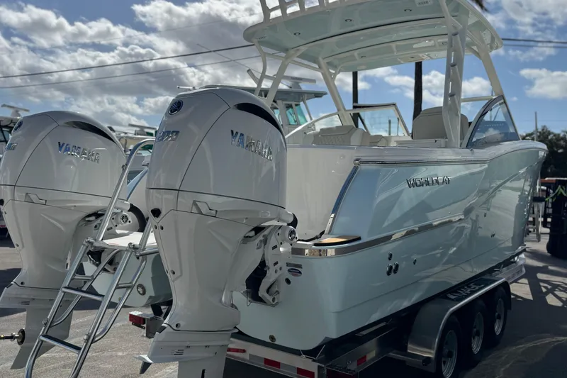 Slide: The Image of 2026 World Cat 280 DC-X boat with dual Yamaha engines on a trailer. - 3