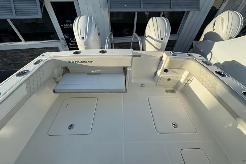 Slide: The Image of 2026 World Cat 280 DC-X boat deck with seating and storage compartments. - 4
