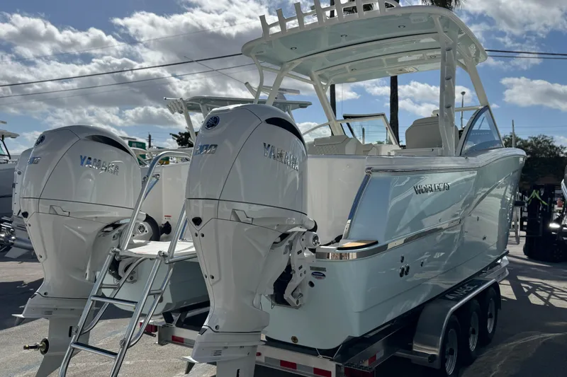 Slide: The Image of 2026 World Cat 280 DC-X boat with twin Yamaha engines on a trailer. - 9