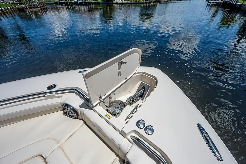 Slide: The Image of 2019 Grady-White Canyon 456 boat anchor compartment with open hatch. - 10