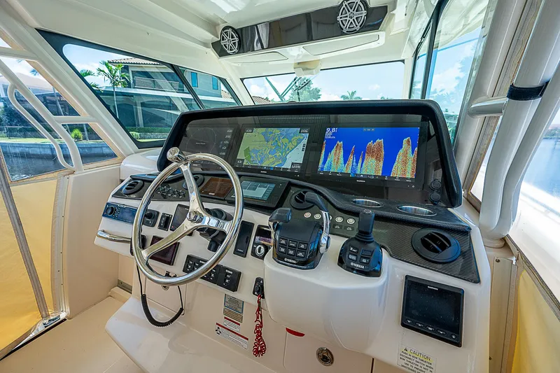 Slide: The Image of 2019 Grady-White Canyon 456 helm with advanced navigation and control systems. - 25