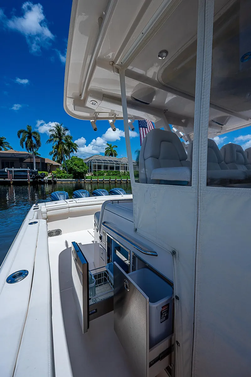 Slide: The Image of 2019 Grady-White Canyon 456 boat interior with seating and storage compartments. - 40