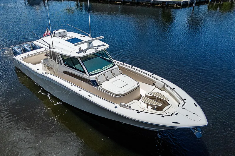 Slide: The Image of 2019 Grady-White Canyon 456 boat on calm water. - 6