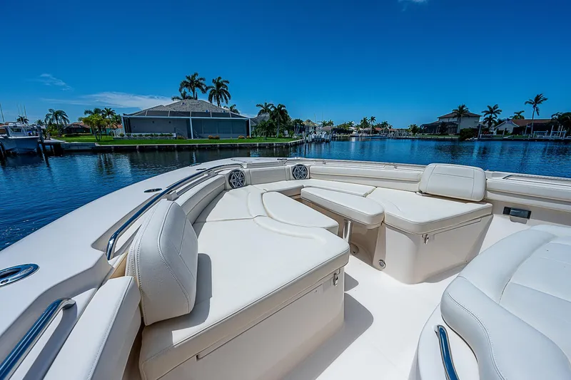 Slide: The Image of 2019 Grady-White Canyon 456 boat with luxurious seating on a sunny day. - 7