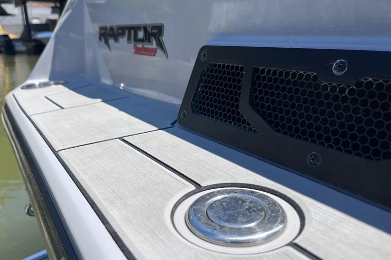 Slide: The Image of 2024 Moomba Max boat with Raptor engine detail, featuring sleek design and modern finishes. - 24