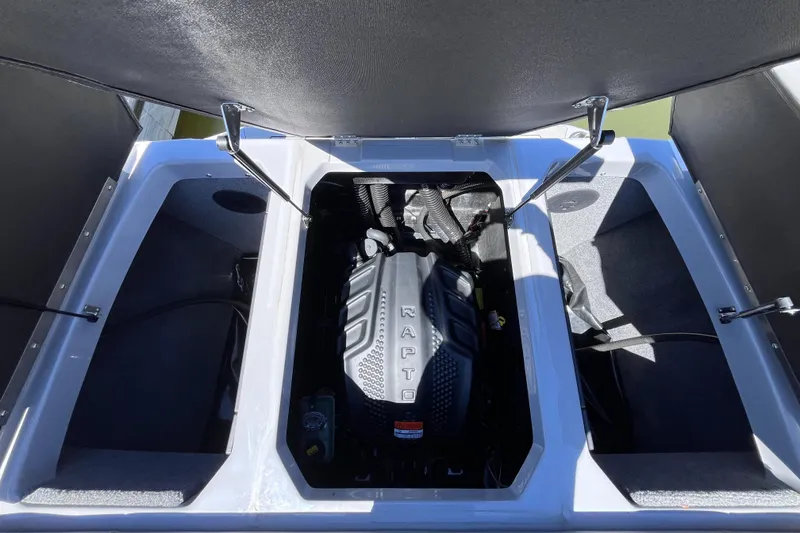 Slide: The Image of 2024 Moomba Max engine compartment with Raptor engine, open storage hatches. - 26
