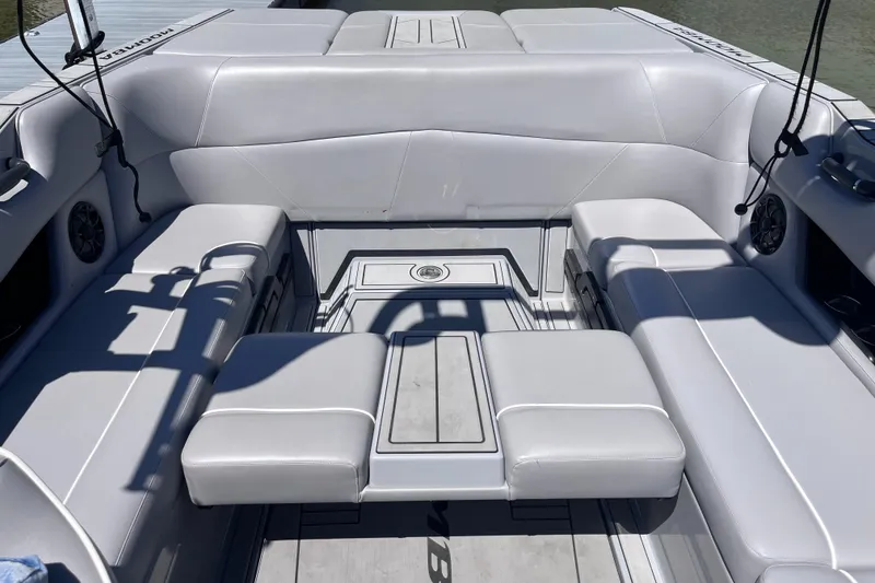 Slide: The Image of 2024 Moomba Max boat interior with sleek gray seating and modern design. - 8