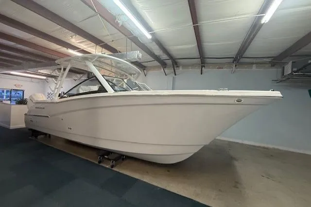 The Image of 2026 World Cat 280 DC-X boat in indoor showroom, side view. - 0