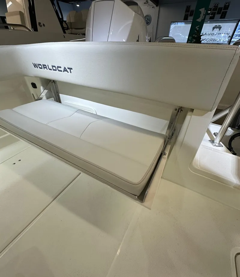 Slide: The Image of 2025 World Cat 280 CCX boat interior with white seating and sleek design. - 11