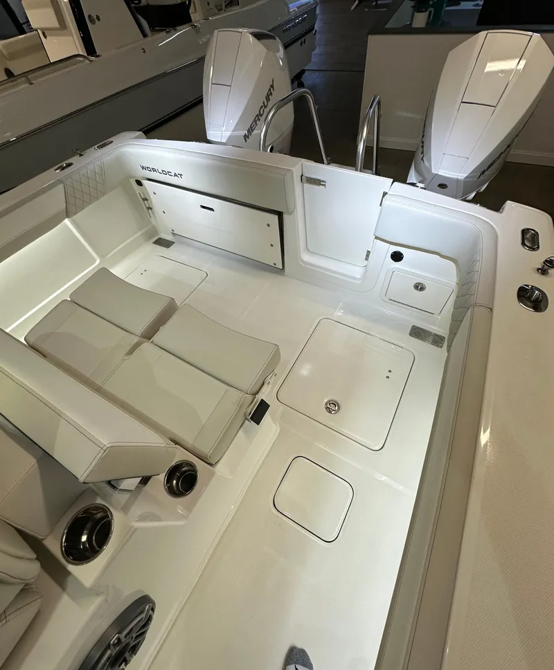 Slide: The Image of 2025 World Cat 280 CCX boat interior with dual engines and sleek seating. - 12