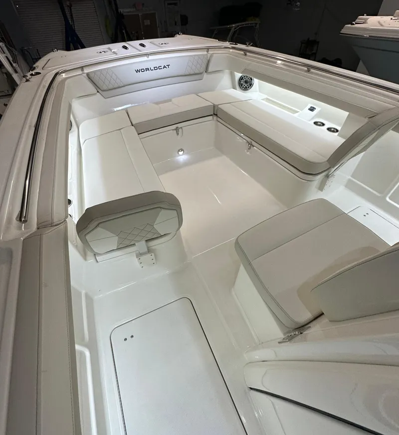 Slide: The Image of 2025 World Cat 280 CCX boat interior with white seating and modern design. - 13