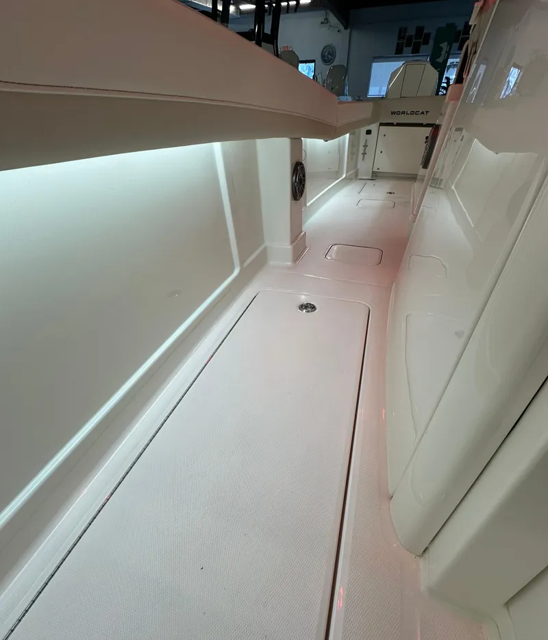 Slide: The Image of 2025 World Cat 280 CCX boat interior with sleek white design and ambient lighting. - 4