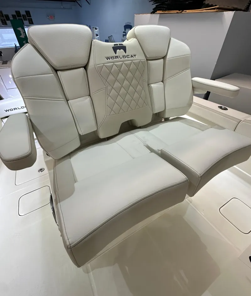 Slide: The Image of 2025 World Cat 280 CCX boat seat with white leather upholstery and diamond stitching. - 6