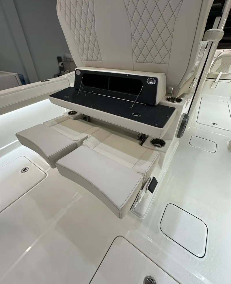 Slide: The Image of Luxury seating on 2025 World Cat 280 CCX boat with foldable footrests. - 8