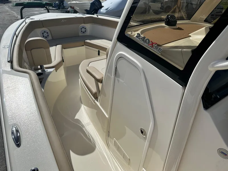 Slide: The Image of 2025 Scout 240 XSF boat interior with seating and storage compartments. - 12