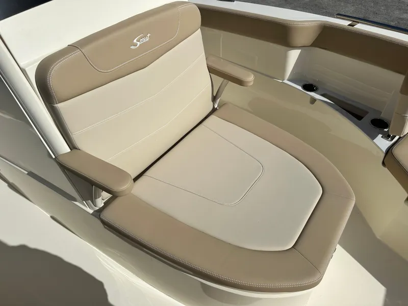 Slide: The Image of 2025 Scout 240 XSF boat seat with beige and tan upholstery. - 16