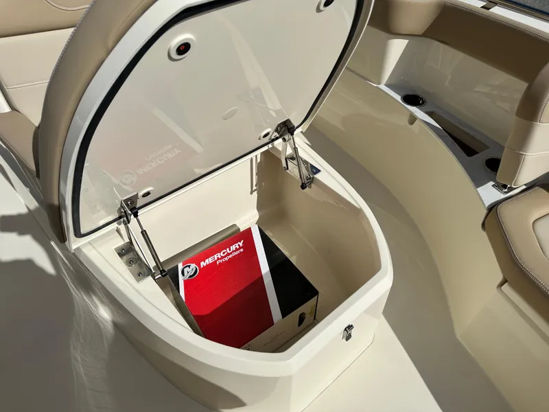 Slide: The Image of 2025 Scout 240 XSF boat storage compartment with Mercury box. - 17