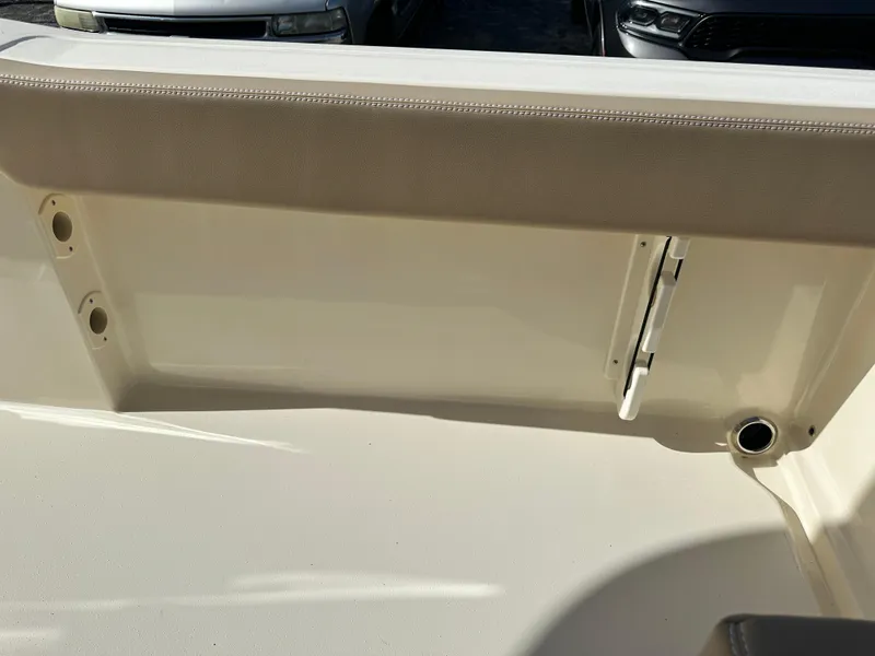 Slide: The Image of 2025 Scout 240 XSF boat interior detail with beige upholstery. - 5