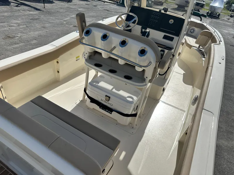 Slide: The Image of 2025 Scout 240 XSF boat interior with seating and console. - 7