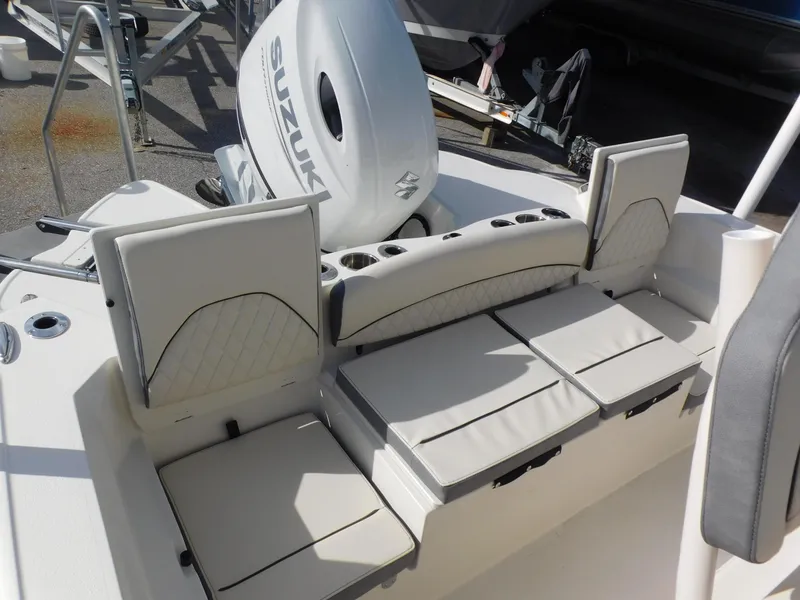 Slide: The Image of 2024 Stingray 216 CC boat with Suzuki engine and cushioned seating. - 12
