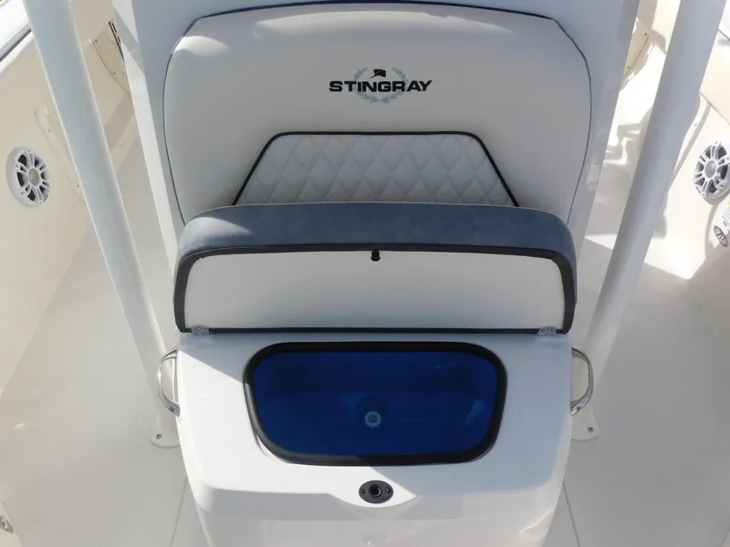 Slide: The Image of 2024 Stingray 216 CC boat interior with storage compartment. - 27