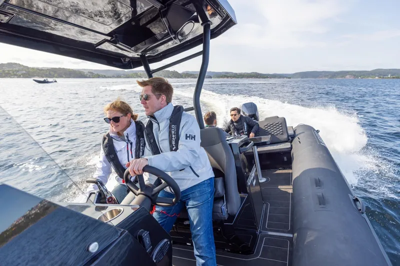 Slide: The Image of People cruising on a Highfield Sport 900 boat, 2026 model. - 5