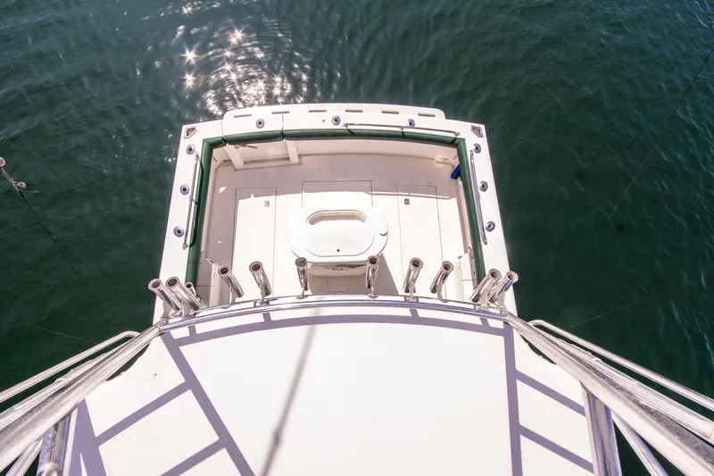 Slide: The Image of 1997 Cabo 35 Express boat deck view over water. - 12