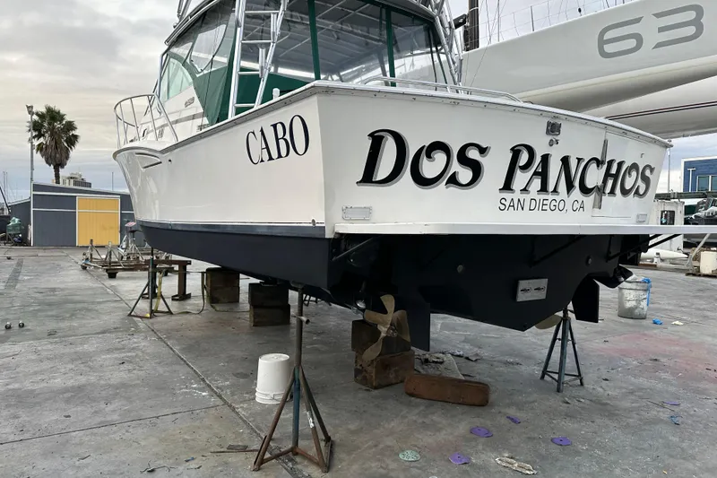Slide: The Image of 1997 Cabo 35 Express boat named "Dos Panchos" in San Diego, CA, on dry dock. - 28