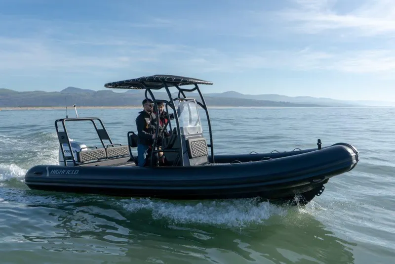 Slide: The Image of 2026 Highfield Patrol 660 boat on calm water. - 5