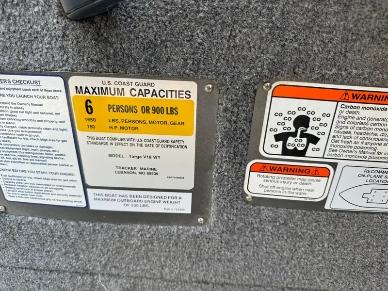 Slide: The Image of 2015 Tracker Targa V-18 WT capacity and safety warning labels. - 10