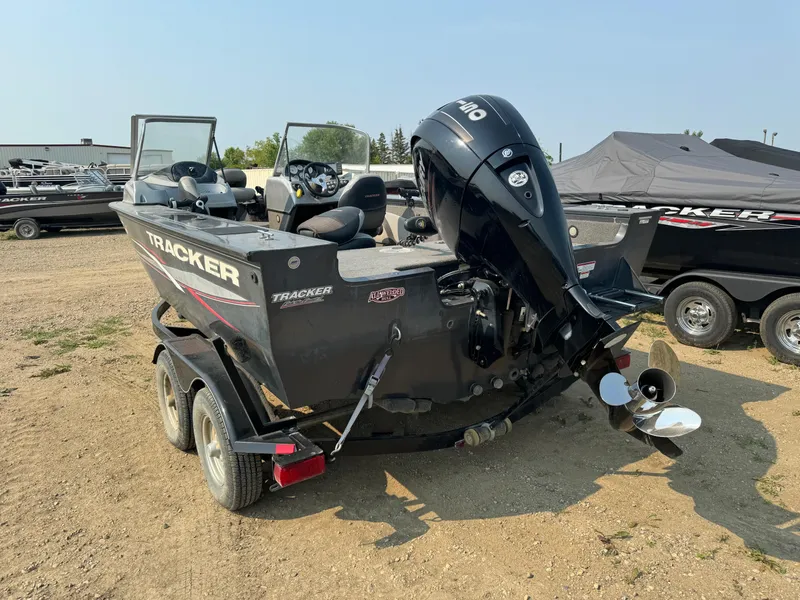 Slide: The Image of 2015 Tracker Targa V-18 WT boat with outboard motor on trailer. - 4
