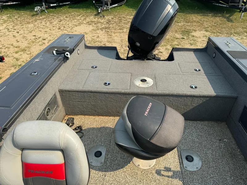 Slide: The Image of 2015 Tracker Targa V-18 WT boat interior with seating and motor. - 7