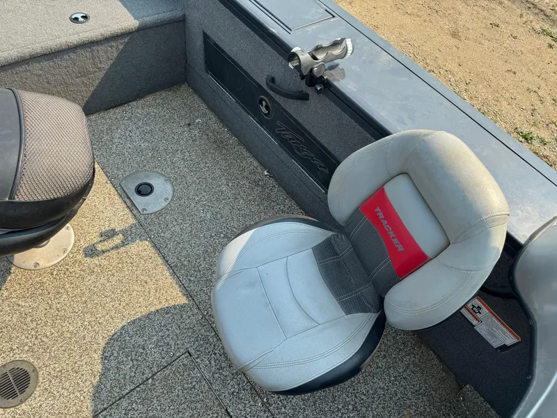 Slide: The Image of 2015 Tracker Targa V-18 WT boat interior with seating and rod holder. - 8