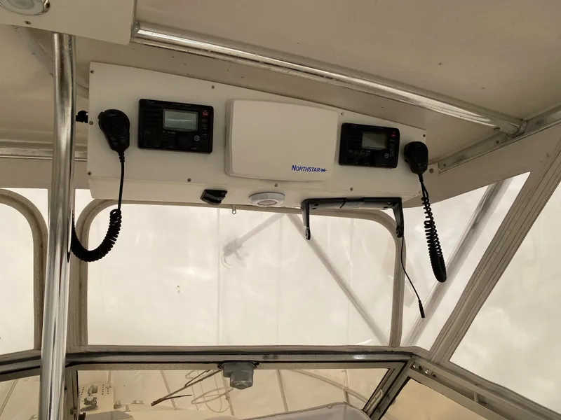 Slide: The Image of 1986 Blackfin 29 Combi boat interior with communication equipment and controls. - 6