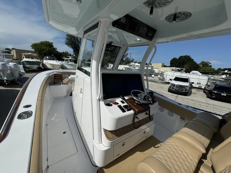 Slide: The Image of 2023 Phenom 34 boat interior with modern helm and seating. - 26