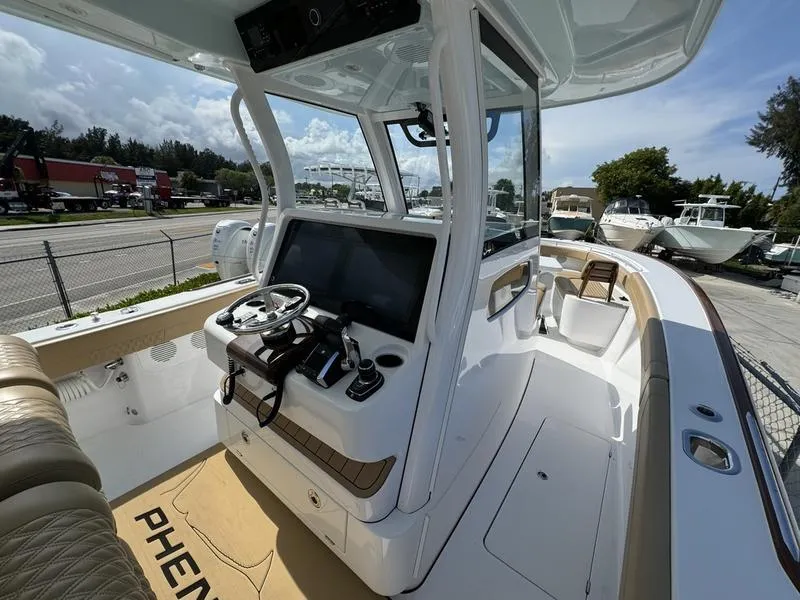 Slide: The Image of 2023 Phenom 34 boat interior with modern helm and seating. - 28