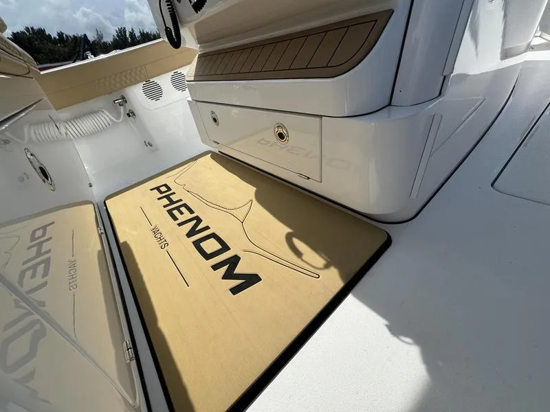 Slide: The Image of Phenom 34 boat interior, featuring branded mat and sleek design, 2023 model. - 30
