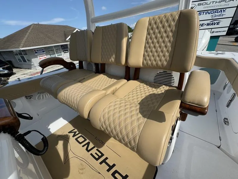 Slide: The Image of Luxurious seating on 2023 Phenom 34 boat with diamond-stitched upholstery. - 39