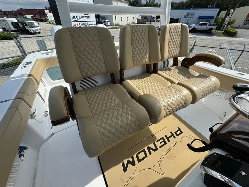 Slide: The Image of Phenom 34 boat seats, 2023 model, featuring beige diamond-stitched upholstery. - 40
