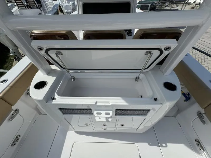 Slide: The Image of Phenom 34 boat interior, open storage compartment, cup holders, 2023 model. - 45