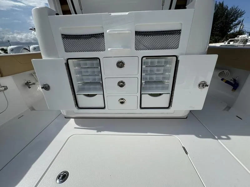 Slide: The Image of Phenom 34 boat storage compartments, open drawers, and cabinets, 2023 model. - 46