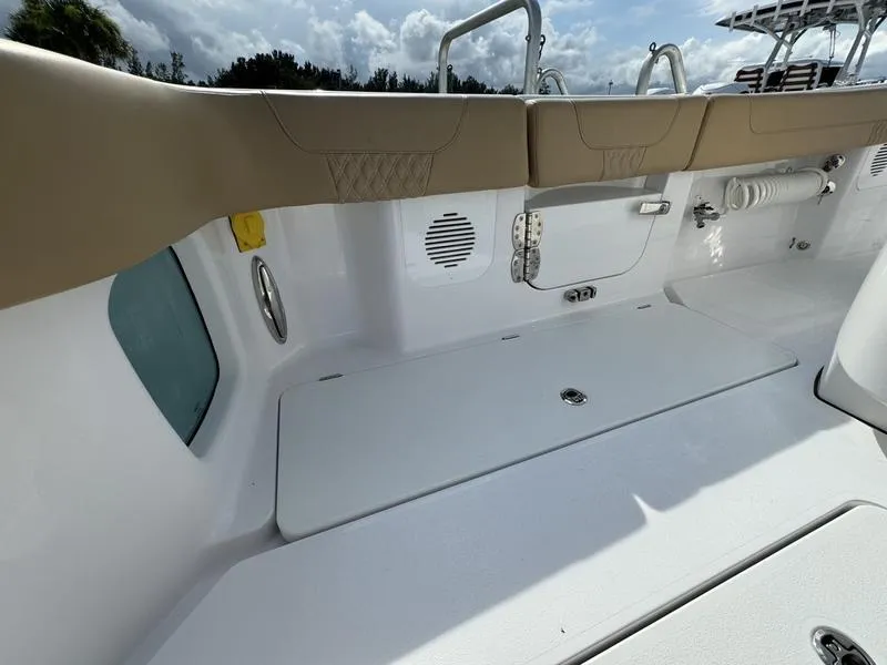Slide: The Image of Phenom 34 boat interior, 2023 model, featuring cushioned seating and storage compartments. - 47