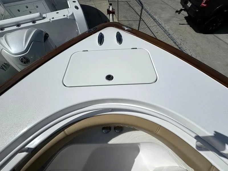 Slide: The Image of Phenom 34 boat bow, 2023 model, featuring sleek white deck design. - 9