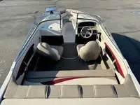 Slide: The Image of 1996 Four Winns 190 Horizon boat interior with seating and steering wheel. - 19