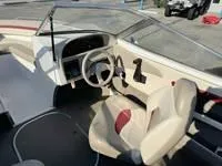 Slide: The Image of 1996 Four Winns 190 Horizon boat interior with steering wheel and seating. - 22