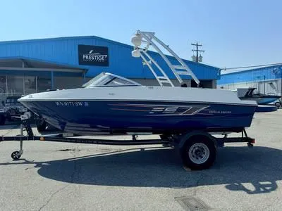 Slide: The Image of 1996 Four Winns 190 Horizon boat on trailer outside Prestige dealership. - 28