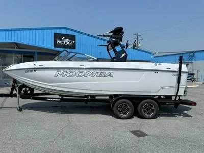Slide: The Image of White 1996 Four Winns 190 Horizon boat on a trailer outside Prestige dealership. - 35